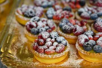 Wild strawberry and raspberry cakes in ancient city of strawberry Nemi, Castelli Romani, Italy