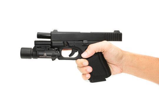 Shooter hand grab on G19 Gen 4th Semi-Auto Pistol attach flashlight, Shooting the 9 mm pistol cartridge.