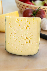 Cheese collection, French fol epi  cheese with many little holes, etorki, tomme noire des pyrenees and ossau iraty cheese