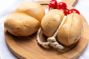 Italian semi hard handmade smoked scamorza cheese, from cow milk from Apulia or Calabria regions