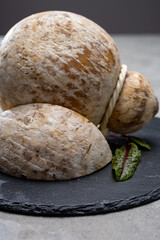 Italian semi hard matured caciocavallo cheese, handmade and aged in natural underground caves in...