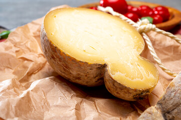 Italian semi hard matured caciocavallo cheese, handmade and aged in natural underground caves in...