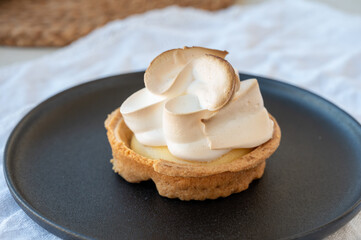One piece of lemon tart with white eggs meringue