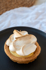 One piece of lemon tart with white eggs meringue