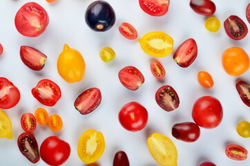 lots of tomatoes on a white background
