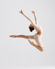 Young gymnast girl stretching and training