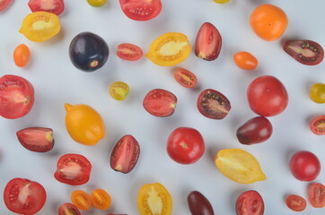 lots of tomatoes on a white background