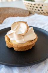 One piece of lemon tart with white eggs meringue