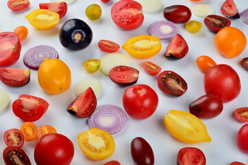 Fototapeta na wymiar lots of tomatoes, onion slices isolated on a white background