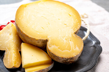 Italian semi hard matured caciocavallo cheese, handmade and aged in natural underground caves in Apulia region