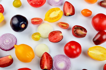 lots of tomatoes, onion slices  isolated on a white background