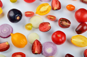 lots of tomatoes, onion slices  isolated on a white background