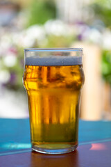 French cold beer in misted glass served on outdoor terrace in small Alpine village in France