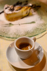 Classic italian espresso coffee served with homemade apple cheese cake with chocolate