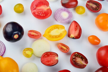 lots of tomatoes, onion slices  isolated on a white background