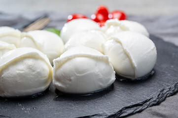 Tasty italian food, fresh white buffalo mozzarella soft cheese balls from Campania