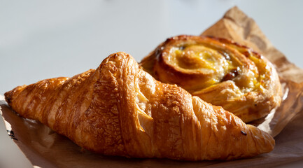 French breakfast in bakery served outdoor, fresh baked croissants and sweet pastry, morning food
