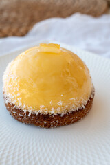 Small yellow  lemon ball tart from French pastry shop