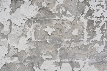 Obraz premium Close up of concrete wall with texture of white paint peeling off