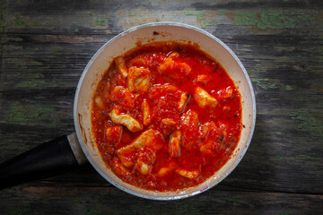 Boiling Chicken Mixed with Tomato Sauce