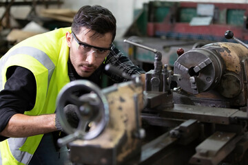 engineer man or factory worker worker milling or working on the machine in factory © offsuperphoto