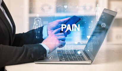 Doctor working a health check with PAIN inscription, recording medical test results