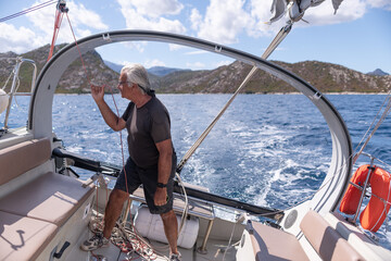 A man sailing a boat in the Mediterranean Sea