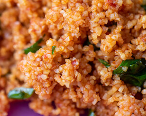 cooked couscous with herbs food background 