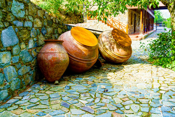 Large Ceramic Amphoras in Courtyard Flooded with Sunlight
