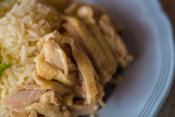 Selective focus of Hainanese chicken rice or steamed chicken rice is Chinese food that popular in Asia