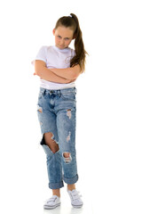 Obraz premium Little girl in a pure white T-shirt for advertising and jeans.