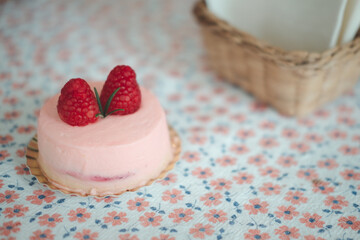 Pink mousse dessert with two of fresh berries