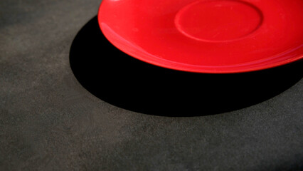 Colorful saucers close-up on a dark background. Abstract composition.