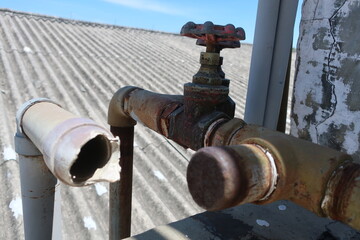 an old broken pipe for repair at a factory during the day, surabaya, east java, indonesia 10/2020.