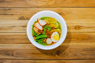 Noodle soup with crispy pork belly and egg. Close up Asian food style