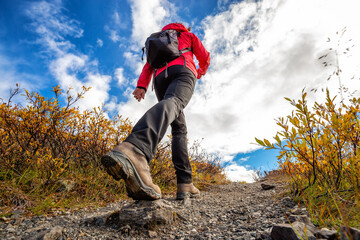View of Woman Hiking Rocky Trail from Below during Fall in Canadian Nature. Taken in Tombstone...