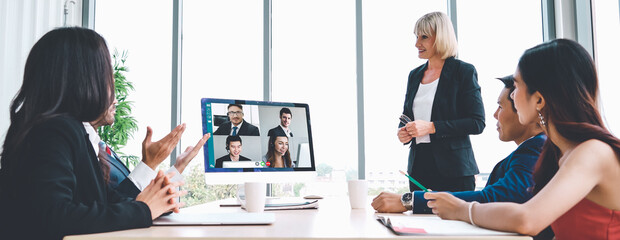 Video call group business people meeting on virtual workplace or remote office. Telework conference call using smart video technology to communicate colleague in professional corporate business.