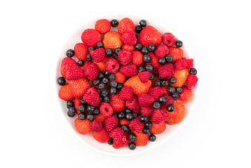 Fresh strawberries, raspberries, mountain ash in a plate on a light background. Berry background. The concept of natural products.