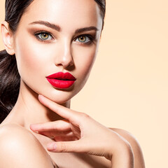Beautiful white girl with a red lipstick on lips. Stunning brunette girl with long black hair....