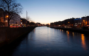 City Center with business quarter at the late sunset time on the river Liffey