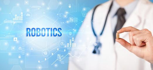 Doctor giving a pill with ROBOTICS inscription, new technology solution concept
