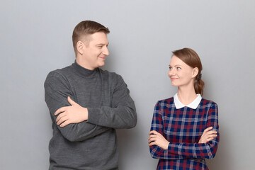 Portrait of happy joyful man and woman standing together and smiling