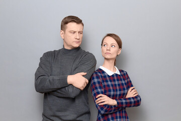 Portrait of man and woman with serious expressions on faces