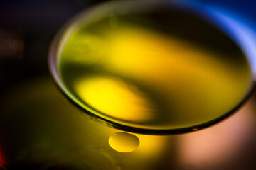 Oil drops in the water create an artistic and imaginatively designed abstract background