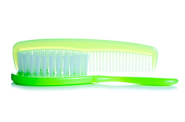 Green baby hair brush comb on white background isolation