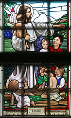 Obraz na płótnie Canvas Jesus the Friend of the Children stained-glass window in the church of St John the Baptist in Sveti Ivan Zabno, Croatia