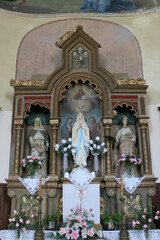Fototapeta na wymiar Altar of the Holy Family in the parish church of St. Martin in Lijeva Dubrovcak, Croatia