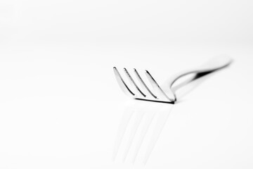 A fork on light background