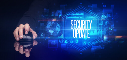 hand holding wireless peripheral with SECURITY UPDATE inscription, cyber security concept