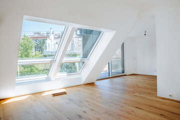 bright empty modern apartment with large windows 